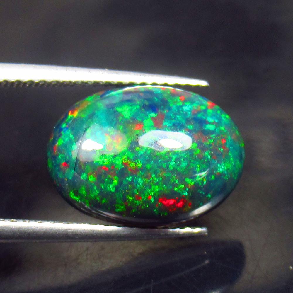 3.45 Ctw Natural Black Fire Opal Oval Cabochon: No Reserve! Title: 3.45 Ctw Natural Black Fire Opal Oval Cabochon Stone Clarity: Opaque Gemstones: Natural Opal Carat Weights: 3.45 Size/Dimensions: 14.40 x 10.30 x 5.20 mm Additional Information: Sha