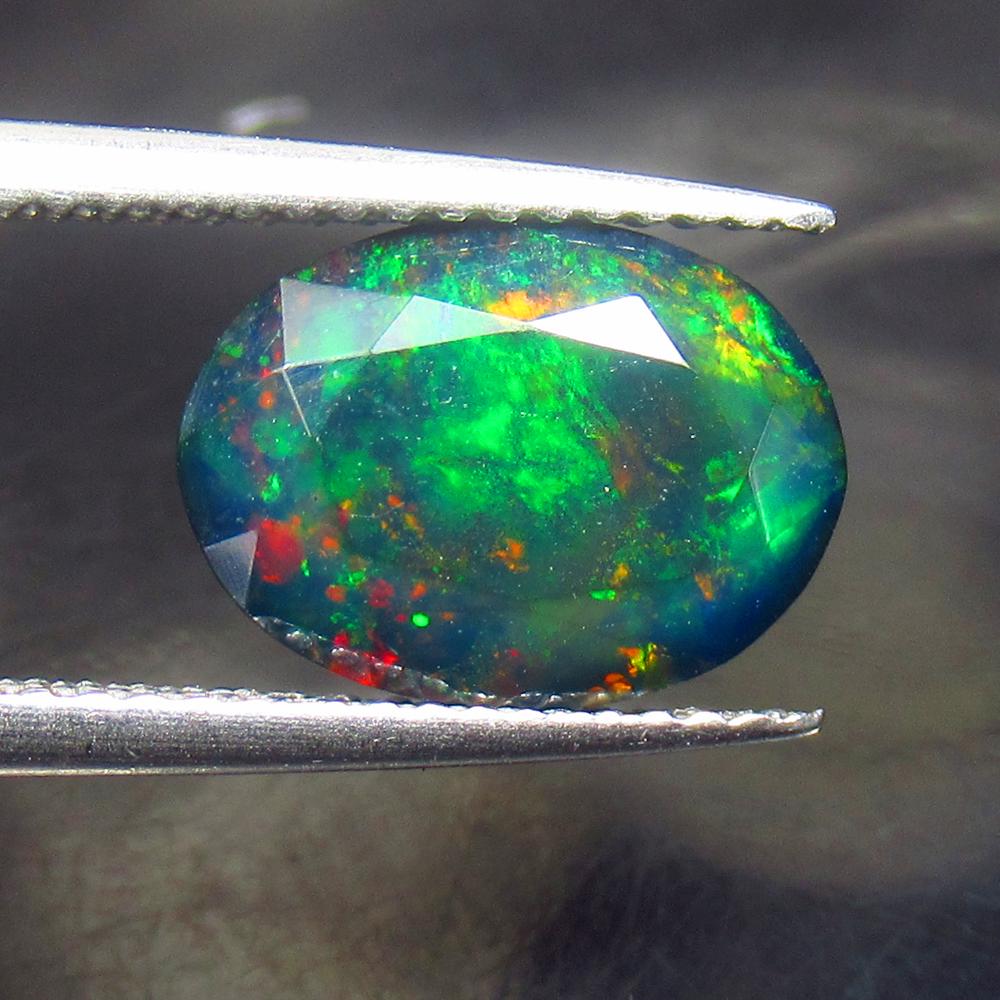 1.86 Ctw Natural Black Fire Opal Oval Cut: No Reserve! Title: 1.86 Ctw Natural Black Fire Opal Oval Cut Stone Clarity: Translucent Gemstones: Natural Opal Carat Weights: 1.86 Size/Dimensions: 11.30 x 8.30 x 4.80 mm Additional Information: Shap