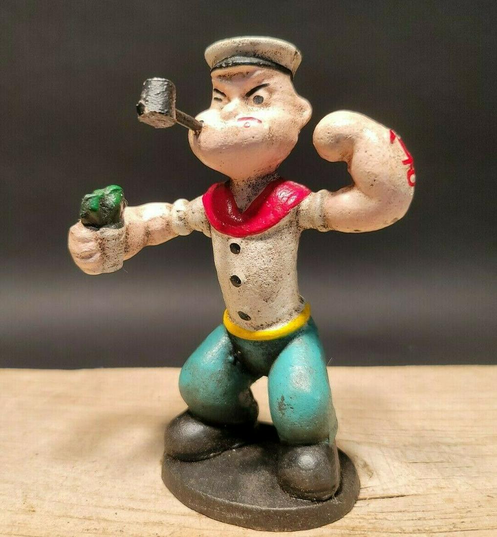 Cast Iron Popeye Sailor Figure Statue: 6" Tall 2 lbs 5 oz Such a neat cast iron statue! As you can see this heavy cast iron car was wonderfully hand painted. Very solid! Looks great on display! Reserve: $25.00 Shipping: Domestic: Flat-rate
