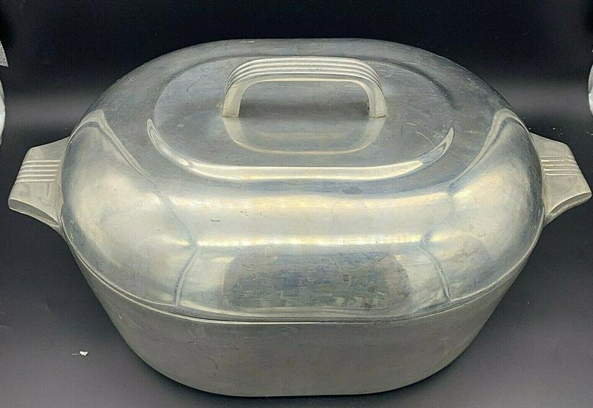 VINTAGE WAGNER WARE MAGNALITE 8 QT ROASTER PAN W/DOME LID & TRIVET: Title: VINTAGE WAGNER WARE MAGNALITE 8 QT ROASTER PAN W/DOME LID & TRIVET Date/Period: 1940's-50's Dimension: APPROX 15.5 W X 10 W X 8.5 TALL WITH LID ON Materials: aluminum Additional Information: VI