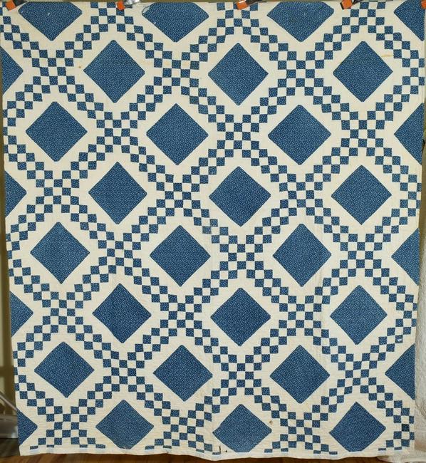 1880's Blue & White Irish Chain Quilt: Cotton 1880's blue and white Irish chain quilt, all hand pieced and hand quilted. It measures 70" X 80" and is in fair condition, with surface dirt, age staining, wear and holes (mostly near the edges