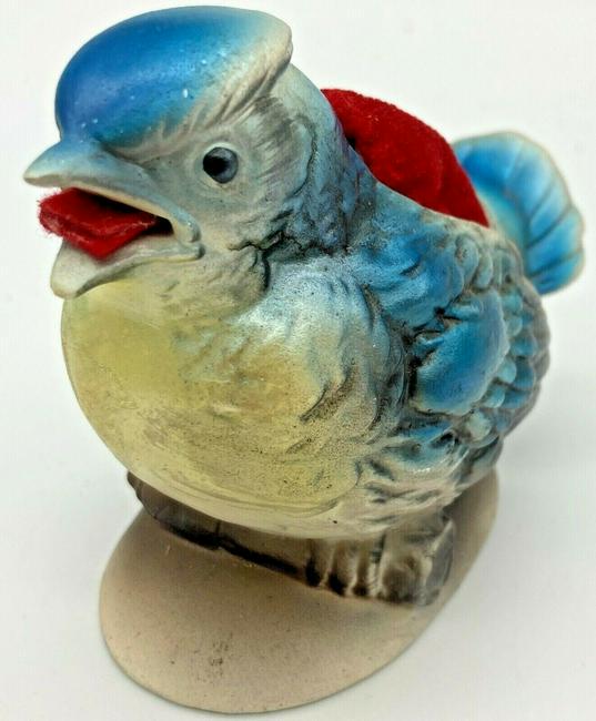 VINTAGE ENESCO BLUE JAY BIRD PIN CUSHION TAPE MEASURE THIMBLE HOLDER: Title: VINTAGE ENESCO BLUE JAY BIRD PIN CUSHION TAPE MEASURE THIMBLE HOLDER Date/Period: approx 1950's Dimension: approx 4 x 3.75 x 2" Materials: ceramic Additional Information: VINTAGE ENESCO BLUE JA