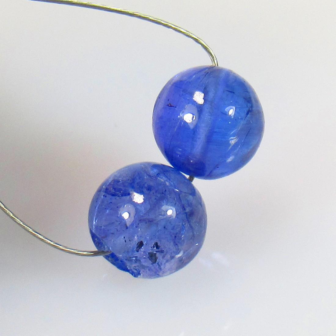 4.86 Ctw Natural 2 Drilled Tanzanite Round Ball Beads: No Reserve! Title: 4.86 Ctw Natural 2 Drilled Tanzanite Round Ball Beads Stone Clarity: Transparent Gemstones: Natural Tanzanite Beads Carat Weights: 4.86 Size/Dimensions: 6.40 - 6.60 mm / 2 PC's Addi