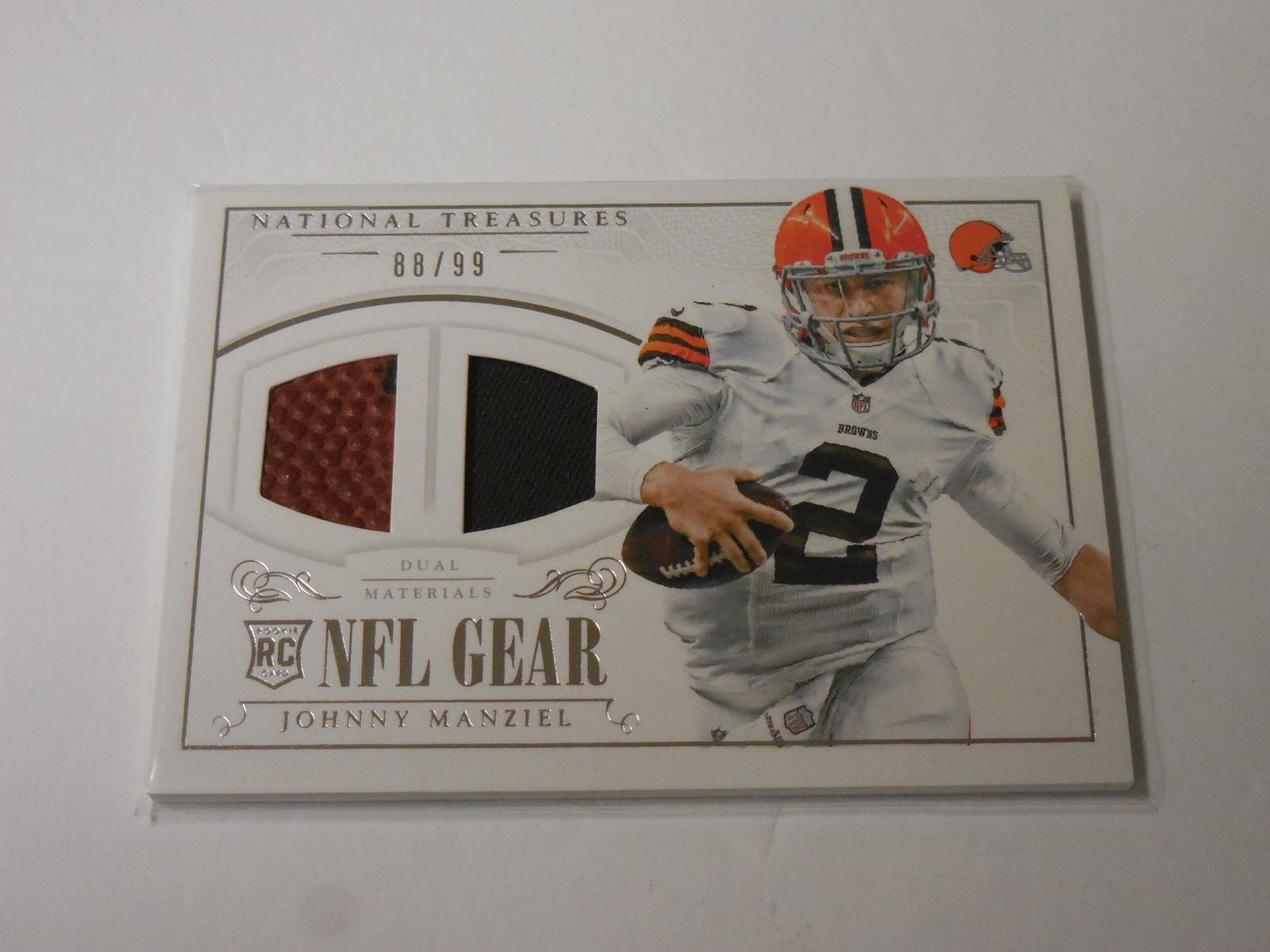 14 PANINI NT JOHNNY MANZIEL DUAL RELIC: 2014 PANINI NATIONAL TREASURES JOHNNY MANZIEL DUAL RELIC CARD #'D 88/99 CLEVELAND BROWNS THIS IS A WONDERFUL CARD FOR ANY COLLECTOR. THE APPROXIMATE CONDITION OF THIS CARD WILL BE LISTED UNDER THE CON