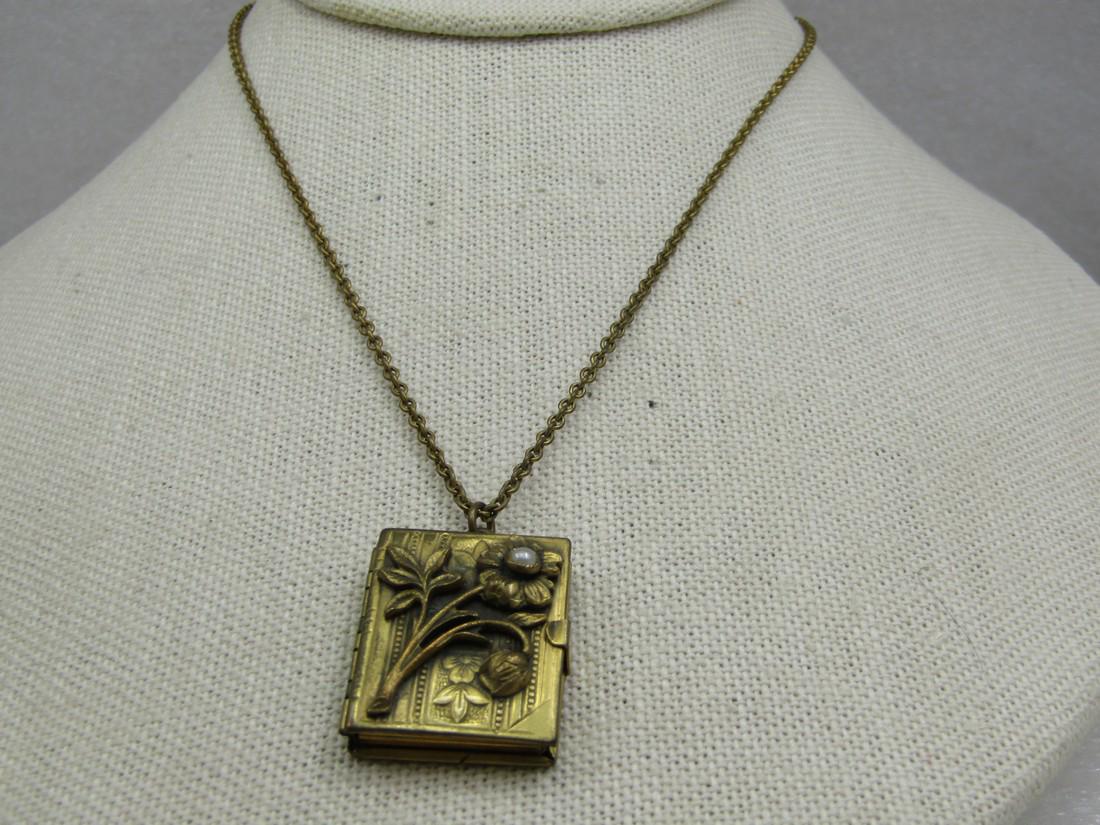 Antique Floral Photo Album Locket Necklace, 18", Germany,: Antique Floral Photo Album Locket Necklace, 18", Germany. 12kt G.F. The locket is appx. 1920's-1930's in age. It has a floral stamped design on the front cover with a floral stem and leaves and a sigl