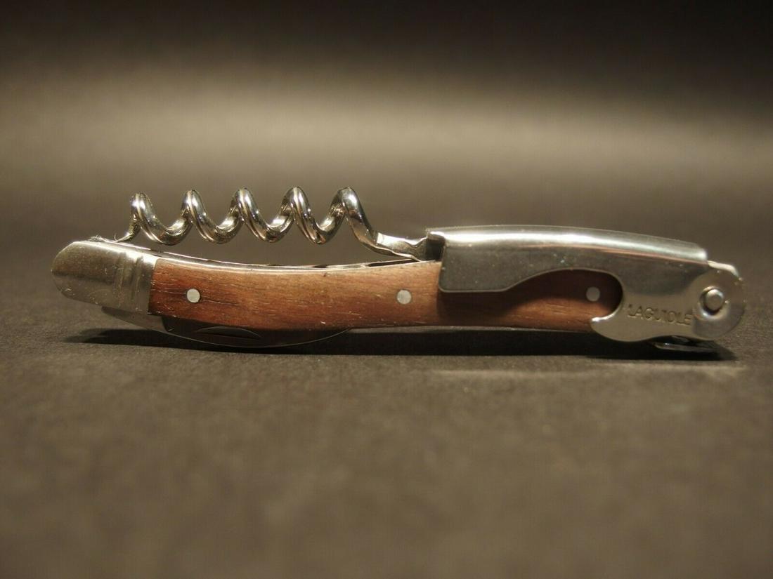Laguiole Corkscrew with Walnut Wood Handles: 4 1/2" long x 5/8" Wide Nice quality, brand new, never used heavy waiters style Laguiole corkscrew with walnut wood handles. This piece is made from stainless steel with a ribbed corkscrew worm and ex