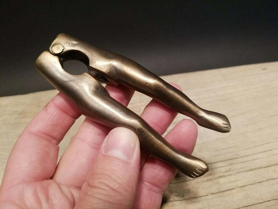Brass Risque Lady Legs Nut Cracker: 4 1/2" long Skull Nut Cracker Antique Vintage Style . Such a unique antique reproduction nut cracker. As you can see the cracker has a skull head on it. Great for use or display. Certain to catch atte
