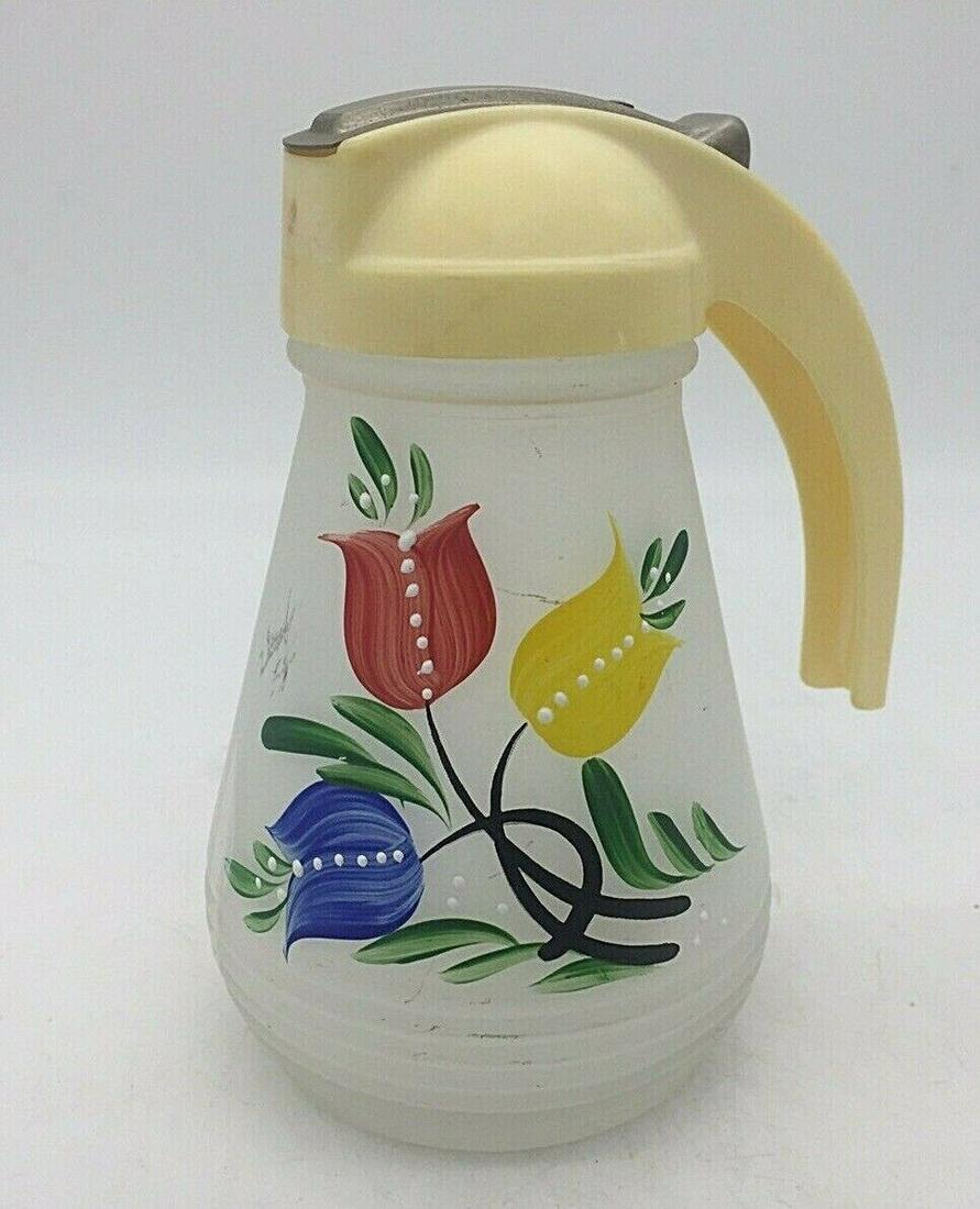 1950's Anchor Hocking Syrup Pitcher: Title: 1950's Anchor Hocking Syrup Pitcher Date/Period: approx 1950-60's Dimension: Approx 5.25" tall Materials: glass, plastic Additional Information: Anchor Hocking Satin Glass Syrup Pitcher Vintage