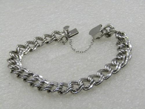 Vintage Elco Double LInk Charm Bracelet, Appx. 9mm, Box Clasp, 1960's: Vintage Elco Double LInk Charm Bracelet, Appx. 9mm, Box Clasp, 1960's, Safety chain. Weight of the bracelet is 14.95 grams. It is marked sterling and tested, anti-tarnish finish. Great to add charms o