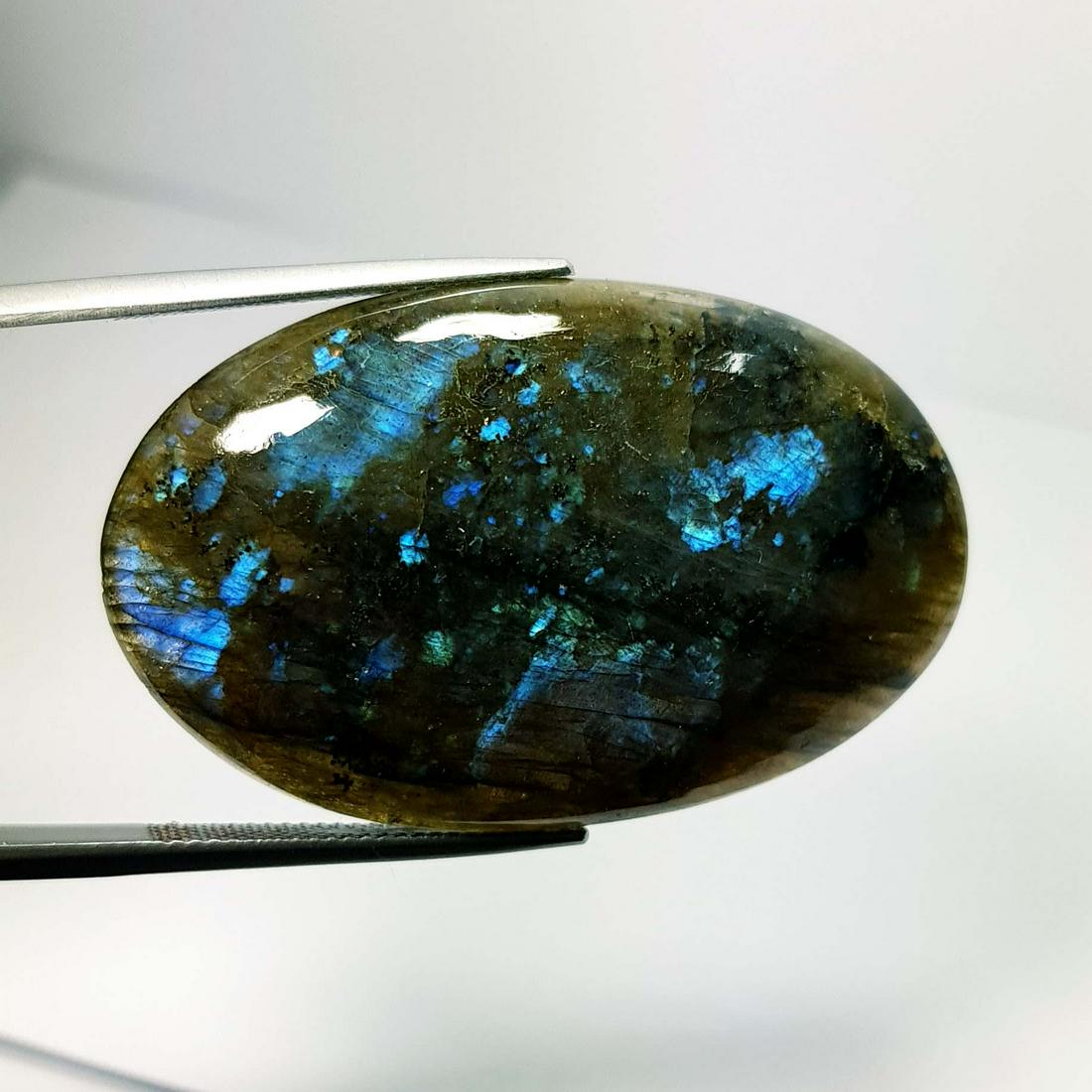 71.22 ct Natural Labradorite: No Reserve! Title: 71.22 ct Natural Labradorite Color/Clarity: Greenish Blue / Opaque Gemstone: Labradorite Carat Weight: 71.22 Size/Dimensions: 44.05 x 27.20 x 7.40 Additional Information: Oval / Afr