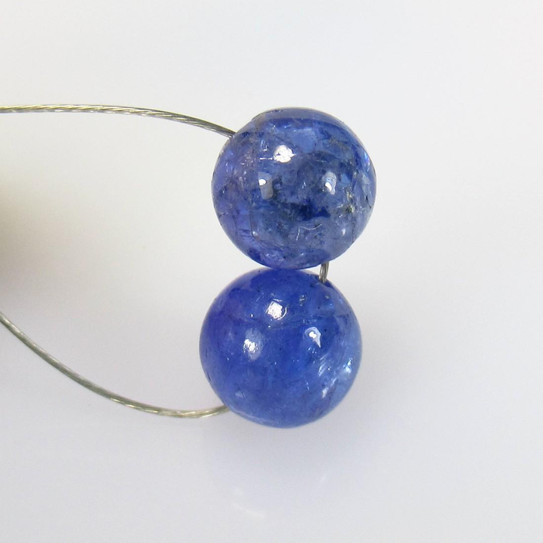 4.61 Ctw Natural 2 Drilled Tanzanite Round Ball Beads: No Reserve! Title: 4.61 Ctw Natural 2 Drilled Tanzanite Round Ball Beads Stone Clarity: Transparent Gemstones: Tanzanite Beads Carat Weights: 4.61 Size/Dimensions: 6.50 - 6.60 mm / 2 PC's Additional I