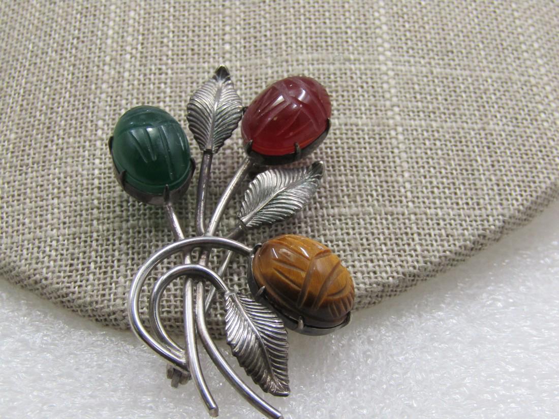 Vintage Sterling Egyptian Scarab Floral Stem Brooch, Signed WRE, 1960's: Vintage Sterling Scarab Floral Stem Brooch, Signed WRE, 1960's, Egyptian Revival sterling 2" by 1.25" wide brooch with three grooved leaves, curved stems and a tiger's eye, carnelian, and jade scarab,