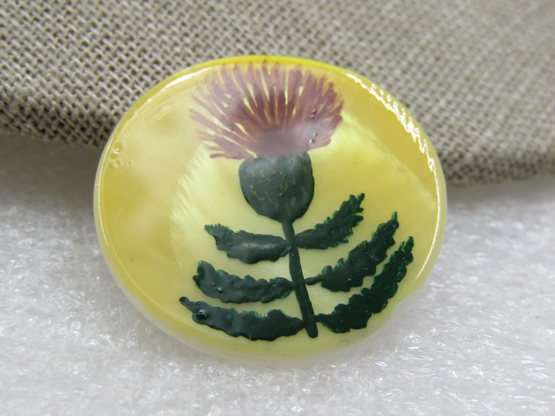 Vintage Scottish Thistle Mother-of-pearl Brooch, Hand-Made: Vintage Scottish Thistle Mother-of-pearl Brooch, Hand-Made. Hand crafted decoupage style brooch witha painted Scottish thistle in green and pink on a 1-1/8" round mother of pearl disk. Age is estimate