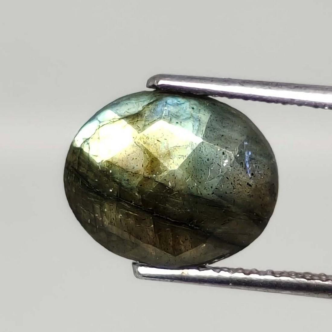 3.75 ct Natural Faceted Labradorite: No Reserve! Title: 3.75 ct Natural Faceted Labradorite Additional Information: Gemstones: Labradorite Carat Weights: 3.75 ct Size/Dimensions: 9 X 11 mm Origin : Labrador Materials & Techniques: Labrad