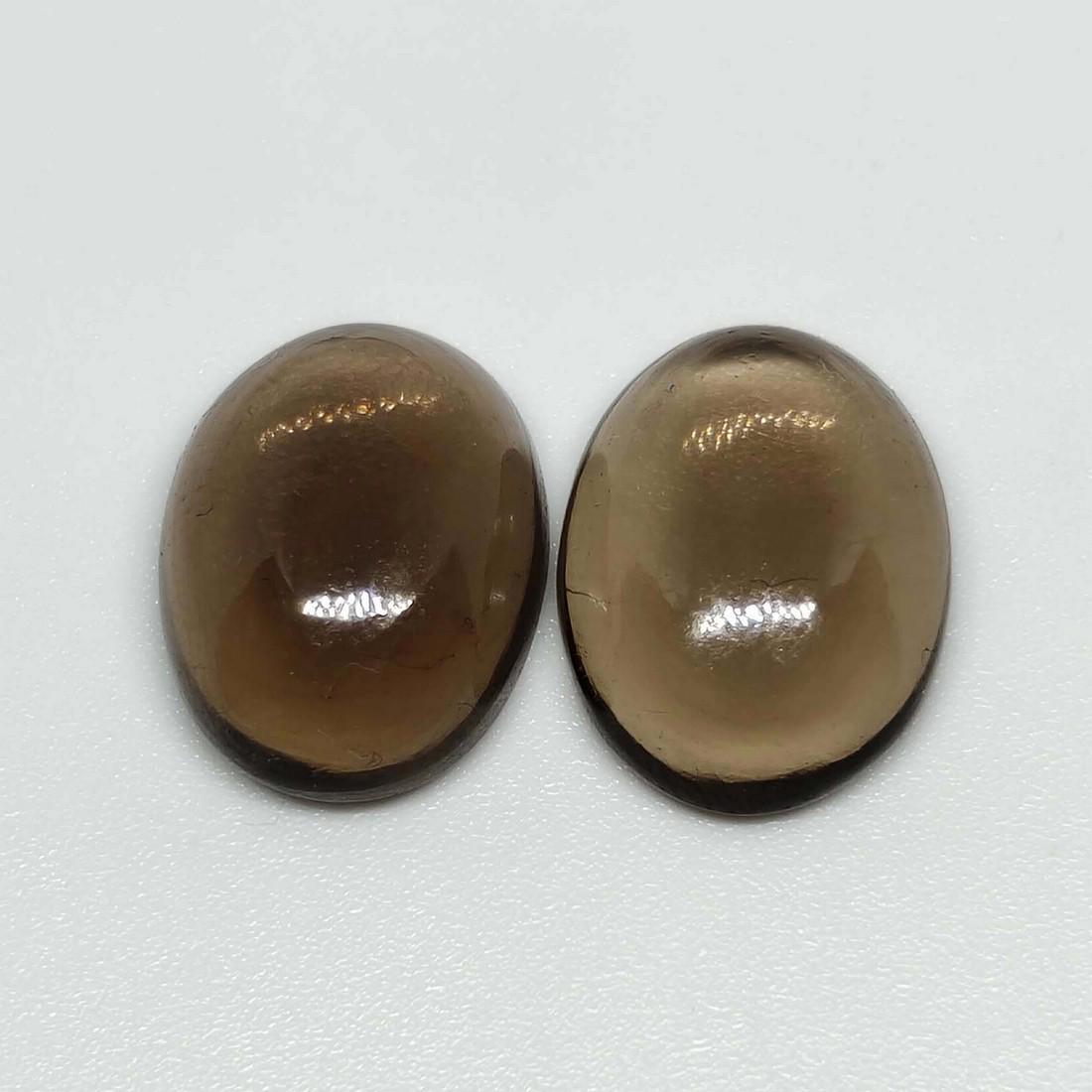 16.70 ct Natural Smoky Quartz Pair: No Reserve! Title: 16.70 ct Natural Smoky Quartz Pair Additional Information: Gemstones: Smoky Quartz Carat Weights: 16.70 ct Size/Dimensions: 16 X 12 X 6 mm Origin : Scotland Materials & Techniques: 