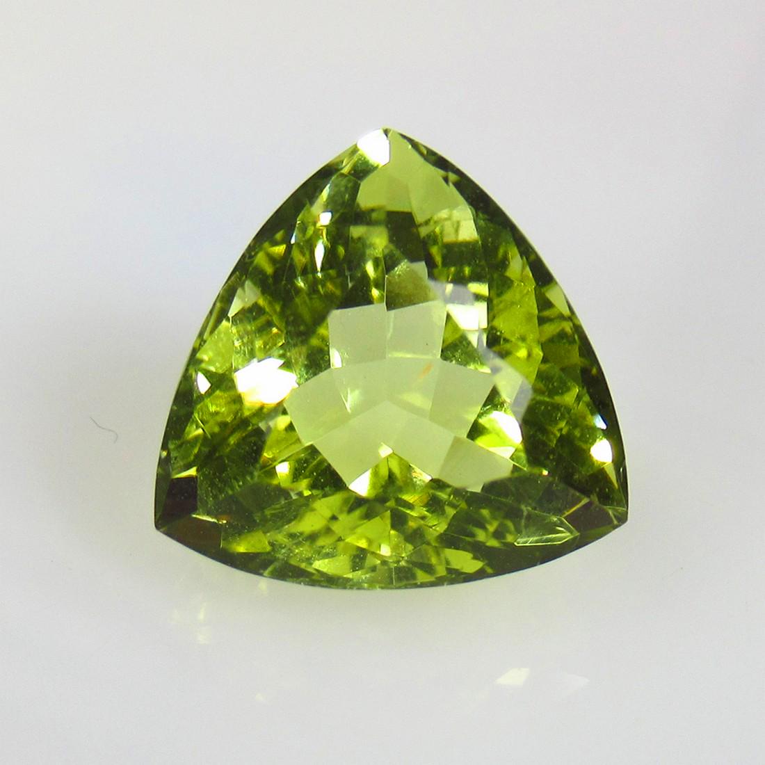7.66 Ctw Natural Lemon Quartz Trillion Cut: No Reserve! Title: 7.66 Ctw Natural Lemon Quartz Trillion Cut Stone Clarity: VVS Gemstone: Natural Lemon Quartz Carat Weights: 7.66 Size/Dimensions: 12.60 x 12.50 x 9.10 mm Additional Info: Good Luste