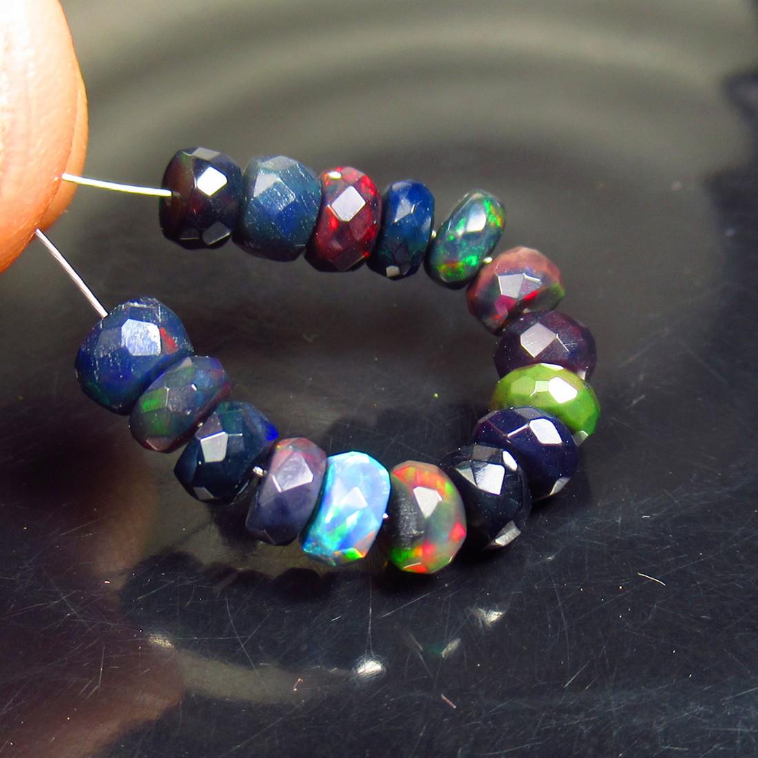 5.26 Ctw Natural 16 Drilled Faceted Black Opal Beads: No Reserve! Title: 5.26 Ctw Natural 16 Drilled Faceted Black Opal Beads Stone Clarity: Translucent Gemstone: Natural Faceted Black Opal Beads Carat Weights: 5.26 Size/Dimensions: 4.40 to 5.00 mm / 16 