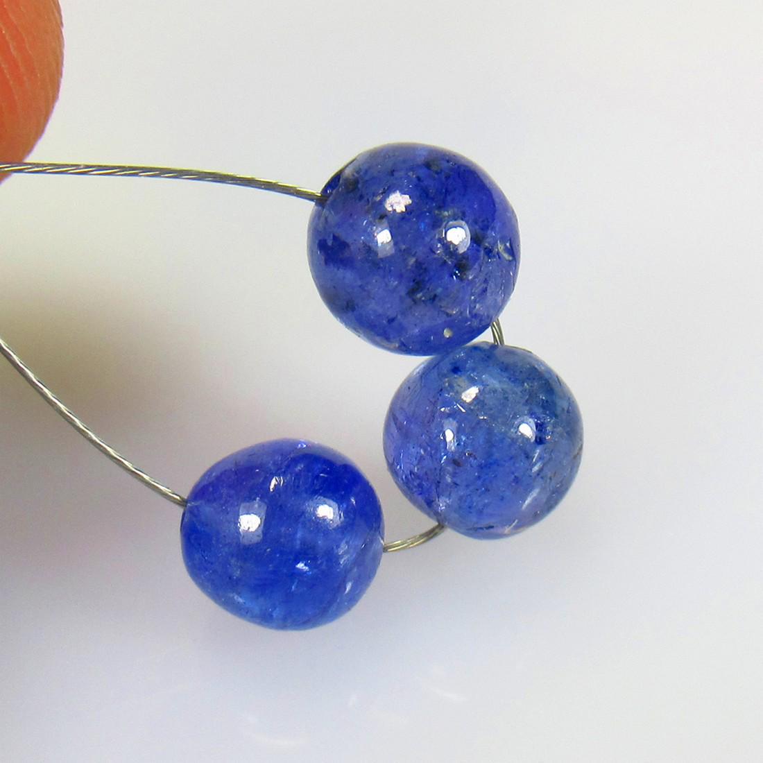 6.67 Ctw Natural 3 Drilled Tanzanite Round Ball Beads: No Reserve! Title: 6.67 Ctw Natural 3 Drilled Tanzanite Round Ball Beads Stone Clarity: Transparent Gemstone: Natural Tanzanite Beads Carat Weights: 6.67 Size/Dimensions: 6.00 - 6.50 mm / 3 PC's Addit