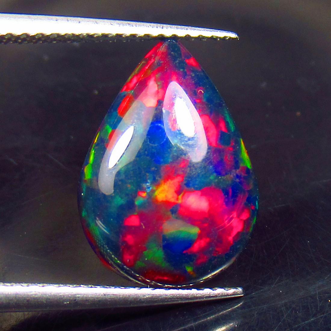 2.86 Ctw Natural Black Fire Opal Pear Cabochon: No Reserve! Title: 2.86 Ctw Natural Black Fire Opal Pear Cabochon Stone Clarity: Opaque Gemstone: Natural Opal Carat Weights: 2.86 Size/Dimensions: 14.90 x 10.70 x 4.10 mm Additional Info: Shape - Pea