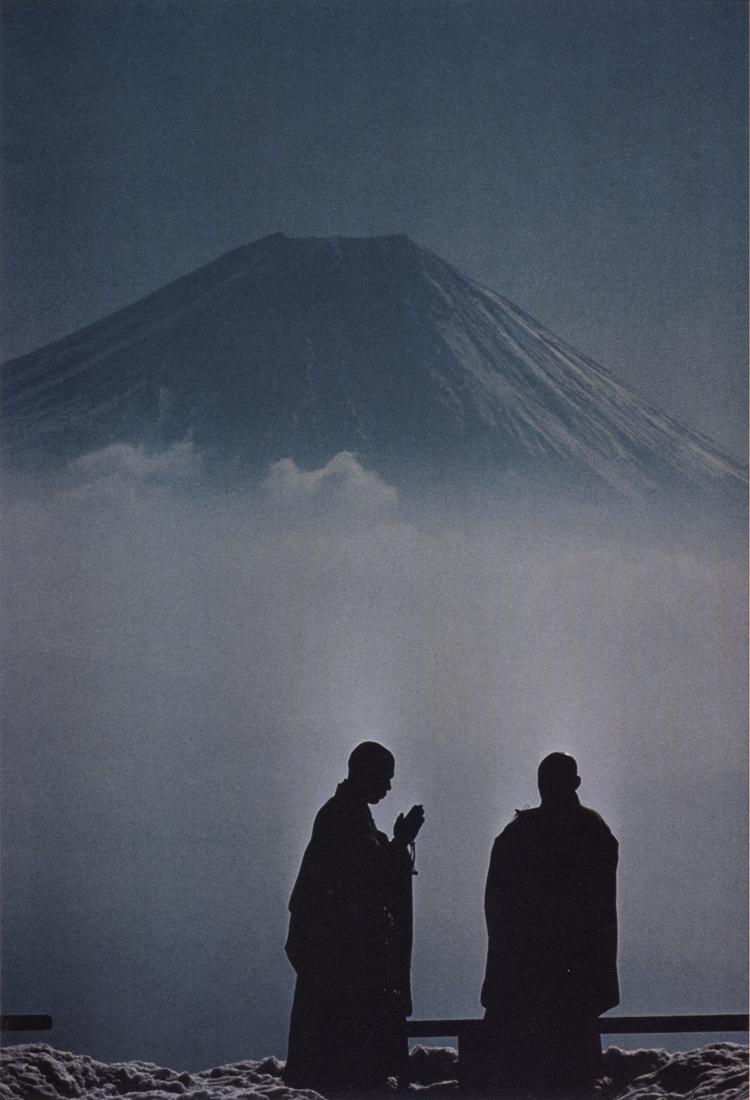 BURT GLINN - Monks In Contemplation of Mount Fuji: Artist: Burt Glinn Title: Monks From Mount Sichimen Monastery In Early Morning Contemplation of Mount Fuji, 1961 Medium: Photo Litho, 2008, China Dimensions: 7.25x10.65" Description: Heat Wax Mounted