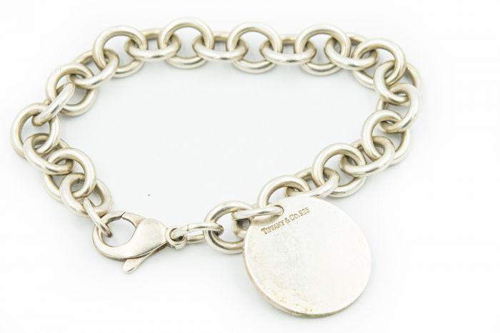 Tiffany & Co. Sterling Silver Charm Bracelet: Title: Tiffany & Co. Sterling Silver Charm Bracelet Description: Tiffany & Co. Sterling Silver Charm Bracelet weighing 22.40Dwt/1Toz measuring 7 1/2 inches in length. Details: Item Number; 123139; Wei