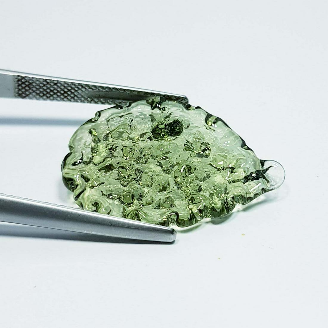 9.60 ct Natural Moldavite: No Reserve! Title: 9.60 ct Natural Moldavite Color/Clarity: Green / Transparent Gemstones: Moldavbite Carat Weight: 9.6 Size/Dimensions: 25.58 x 19.77 x 3.75 Additional Information: Fancy / Czech Ship