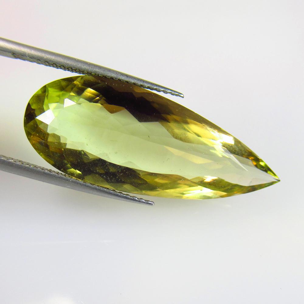 16.01 Ctw Natural Bi-Color Lemon Quartz Pear Cut: No Reserve! Title: 16.01 Ctw Natural Bi-Color Lemon Quartz Pear Cut Stone Clarity: VVS Gemstones: Natural Lemon Quartz Carat Weights: 16.01 Size/Dimensions: 31.00 x 12.20 x 8.10 mm Additional Informat