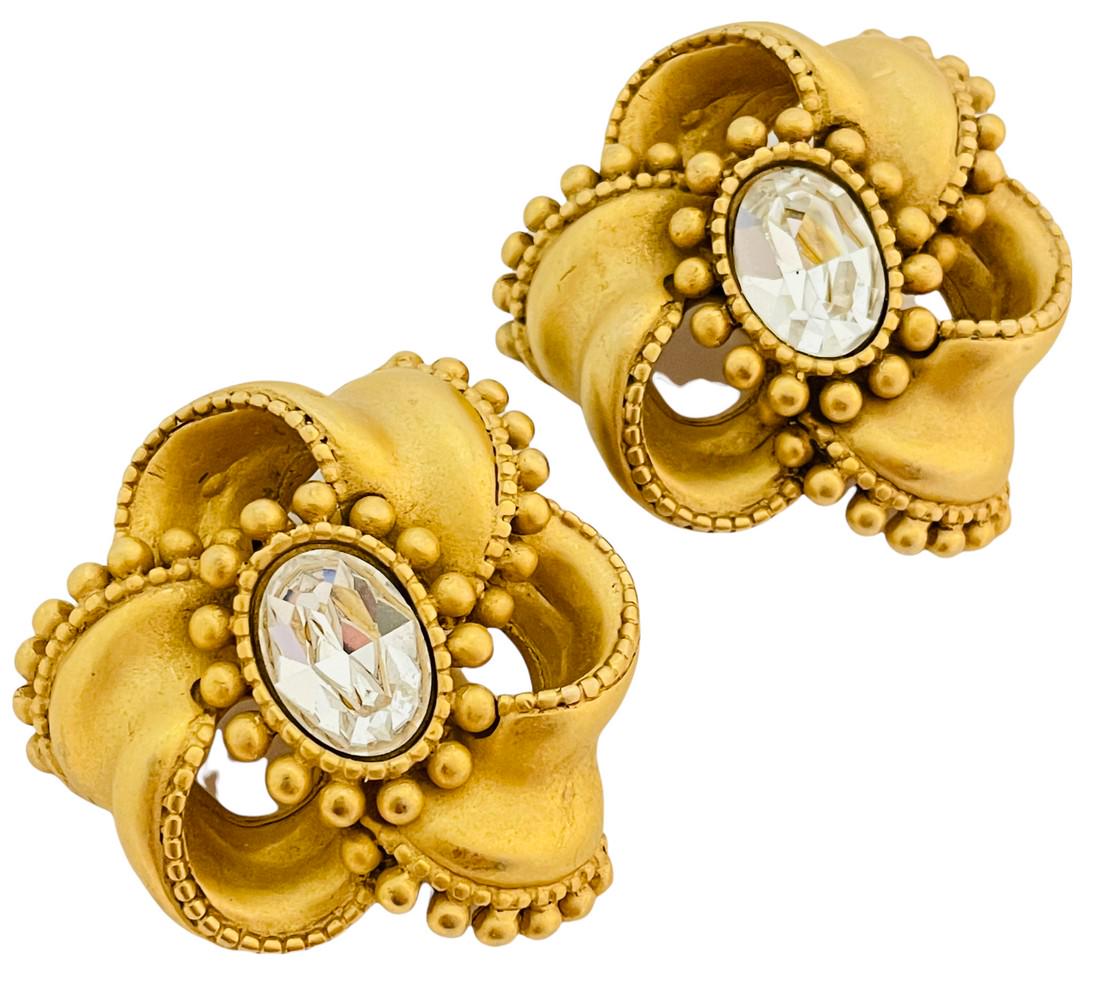 Vintage DKNY DONNA KARAN gold glass flower designer runway clip on earrings: DETAILS • signed DKNY • gold tone with glass rhinestones • vintage designer runway earrings MEASUREMENTS • 1 3/4" in diameter CONDITION • excellent vintage condition with