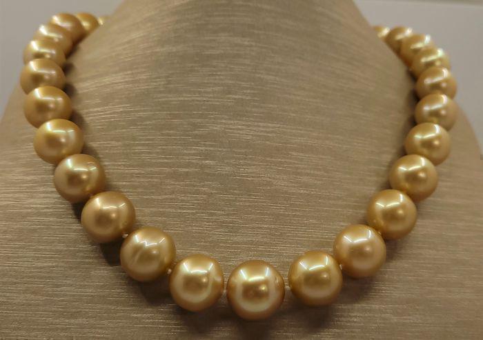 A luxurious near round deep golden pearl necklace, made with 33 lustrous South Sea pearls, and (1 of 12)