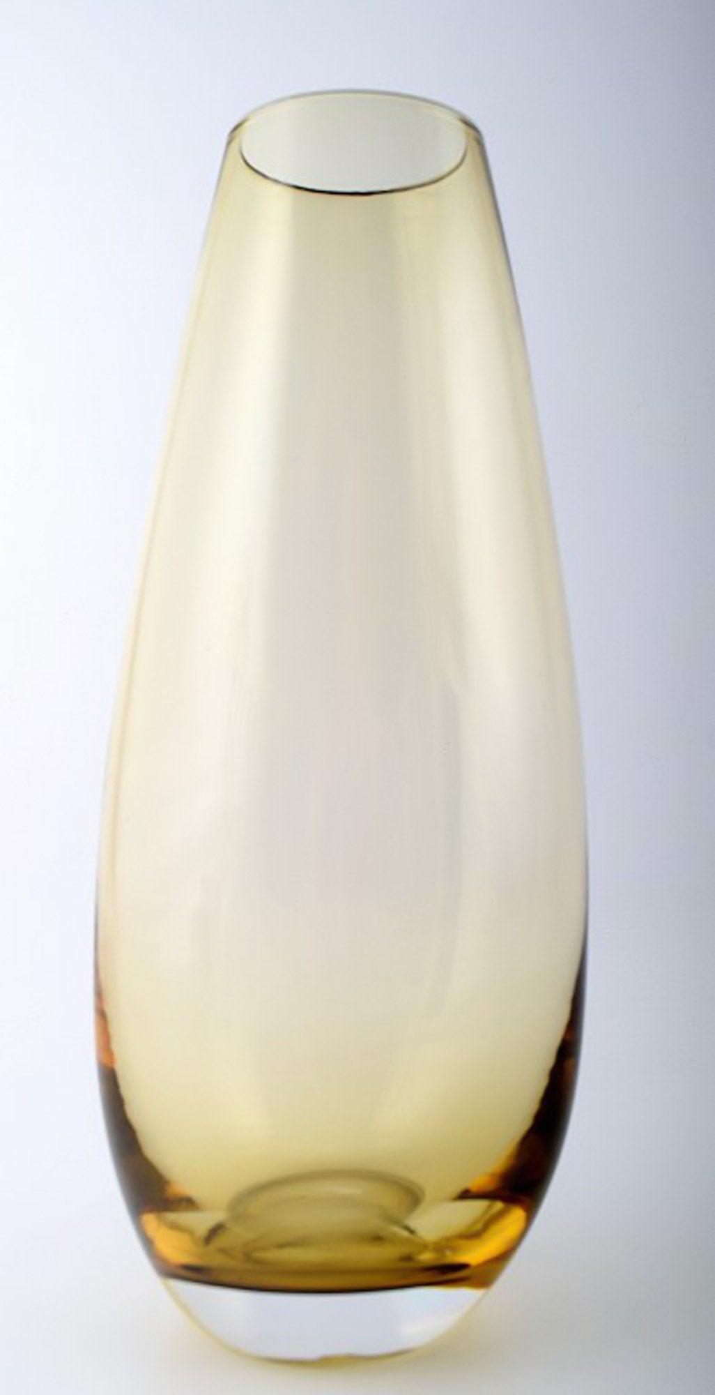 Holmegaard glass vase, smoky colored, 1960s.: Holmegaard glass vase, smoky colored, 1960s. In perfect condition. 29 cm. heights. Unsigned. Reserve: $70.00 Shipping: Domestic: Shipping rates are determined by destination International: Foreign shi