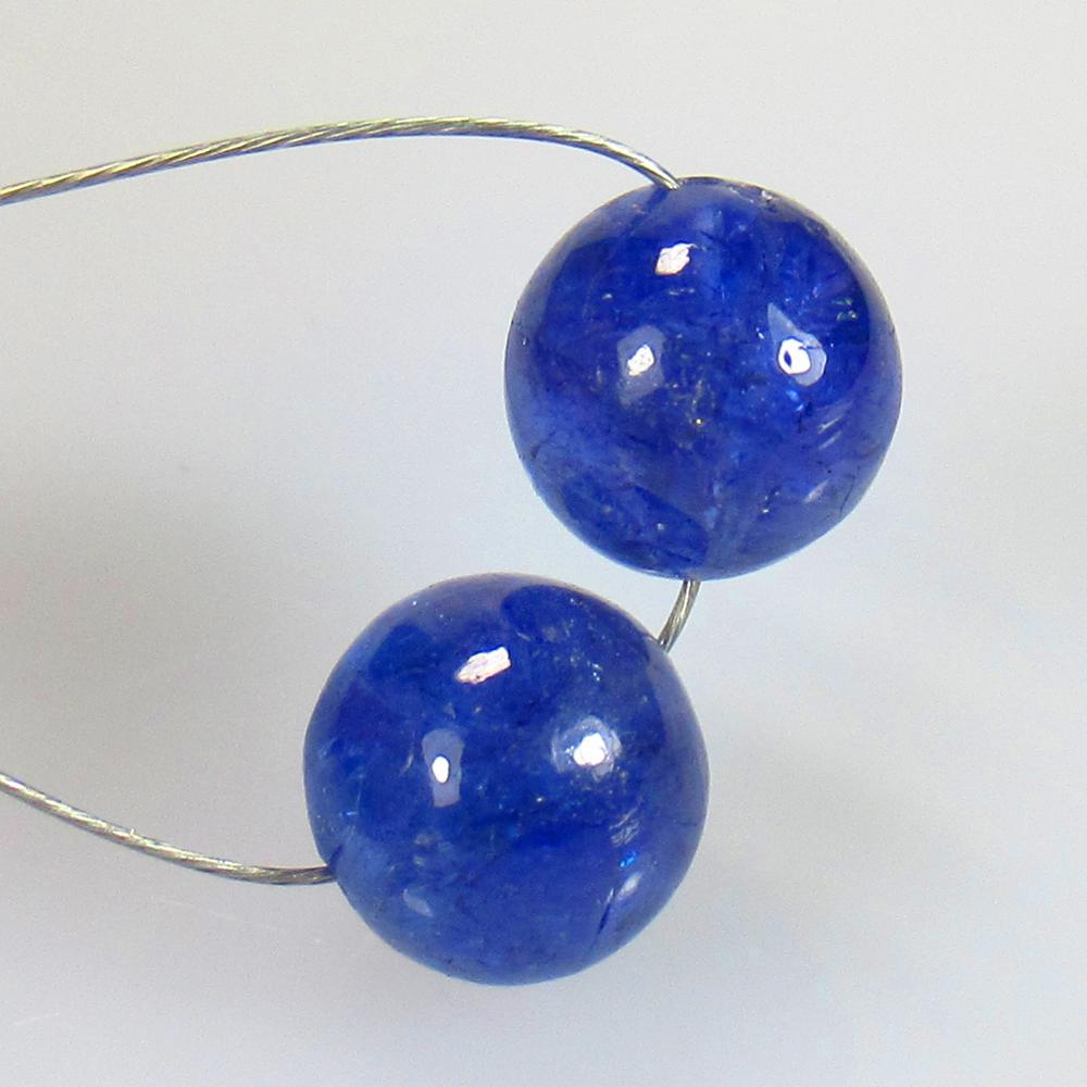 6.15 Ctw Natural 2 Drilled Tanzanite Beads: No Reserve! Title: 6.15 Ctw Natural 2 Drilled Tanzanite Beads Stone Clarity: Semi Transparent Gemstones: Natural Tanzanite Carat Weights: 6.15 Size/Dimensions: 7.00 - 7.10 mm / 2 Pcs Additional Inform