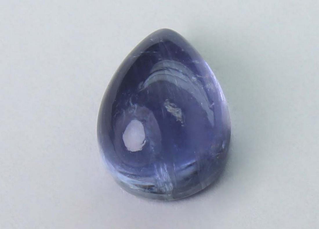 1.59 cts Natural Iolite: No Reserve! Gemstone : Natural Iolite Shape and cut : Pear Cabochon Weight : 1.59 carats Measurements : 7.50x5.48x3.47 mm Color : Violite Transparency : Transparent Treatment : No Treatment Origin : N