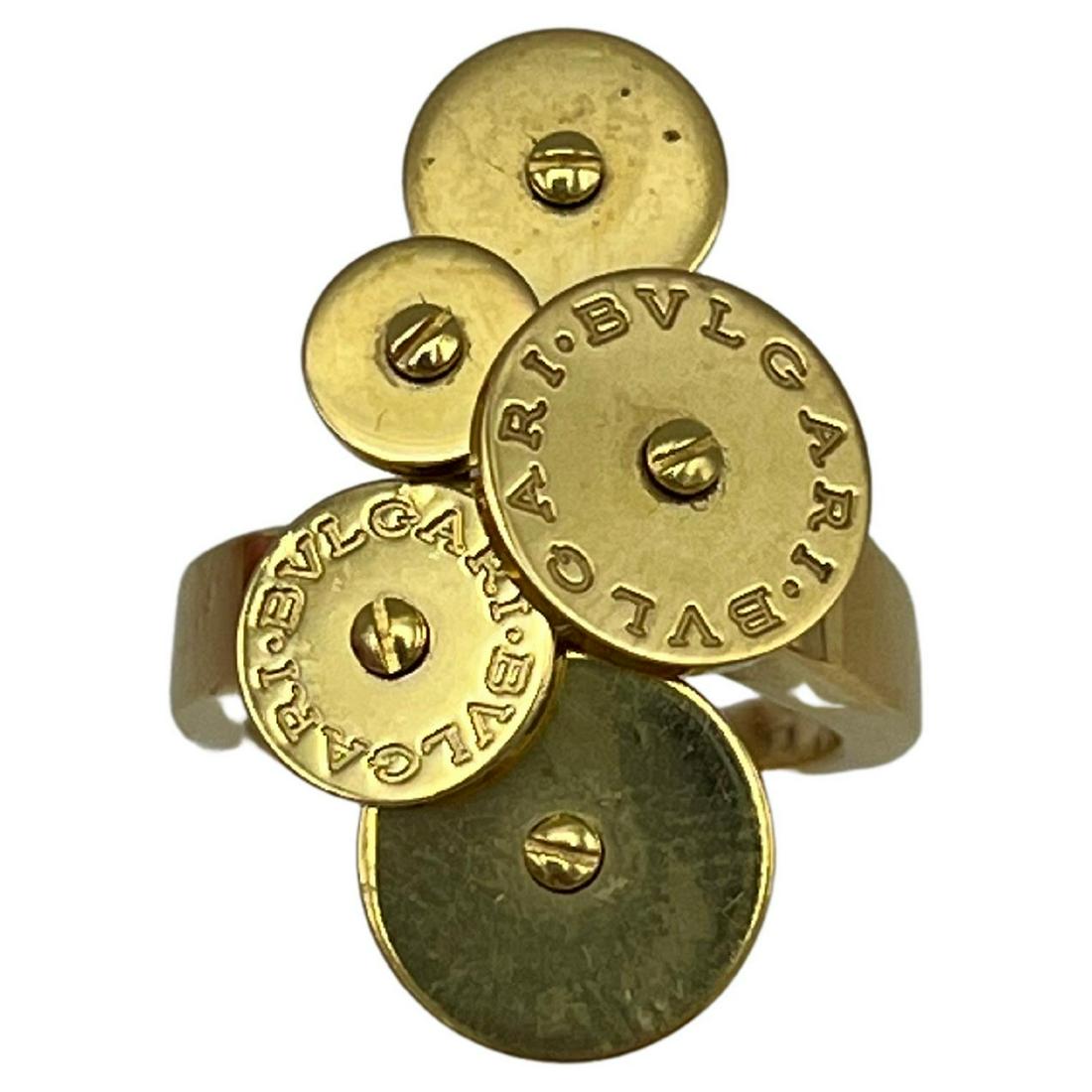 Bulgari Cicladi Yellow Gold Ring: Product details: The ring is made out of 18K yellow gold, it features mechanical motif- some circles spin. The ring is designed by BVLGARI. The ring shows some signs of sizing on the inside of the ban