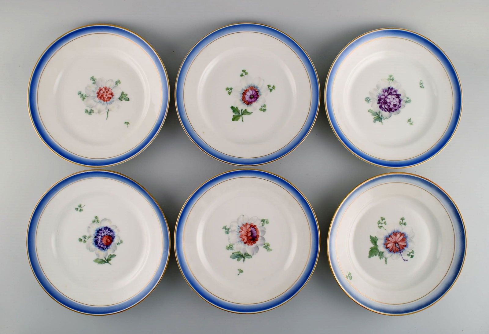 Six antique Royal Copenhagen plates in hand-painted porcelain with flowers and blue border with (1 of 5)