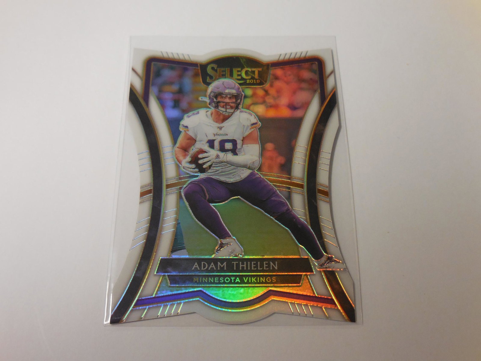19 SELECT ADAM THIELEN #'D 05/35 PRIZM: 2019 PANINI SELECT ADAM THIELEN WHITE DIE CUT PREMIER LEVEL PRIZM #'D 05/35 MINNESOTA VIKINGS THIS IS A WONDERFUL CARD FOR ANY COLLECTOR! PLEASE VIEW THE PHOTO(S) TO HELP DETERMINE THE CONDITION OF TH