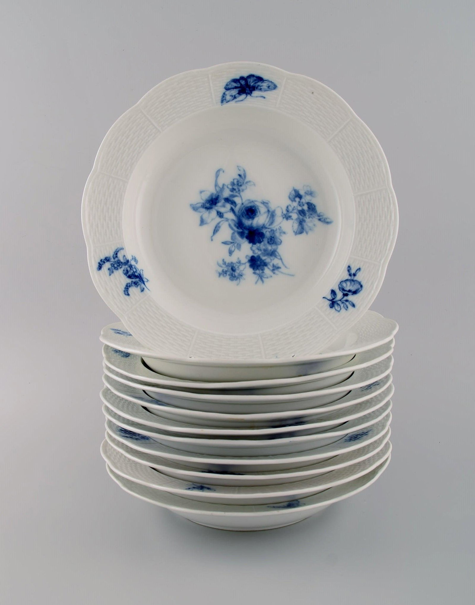 Antique Meissen deep plates in hand-painted porcelain. Blue flowers and butterflies. Late 19th (1 of 4)