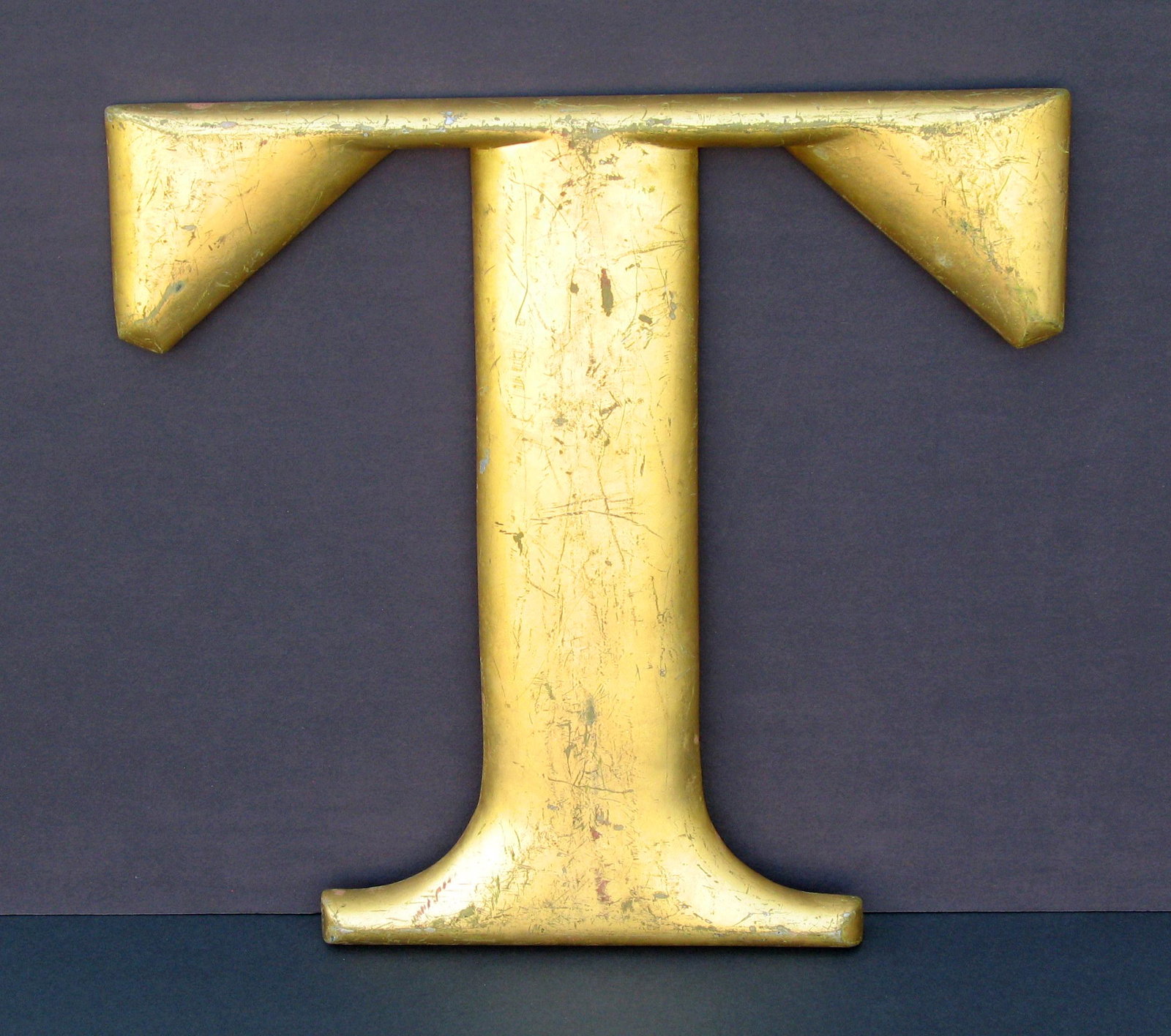 Vintage cast metal letter “T” old gold leaf paint. (1 of 2)