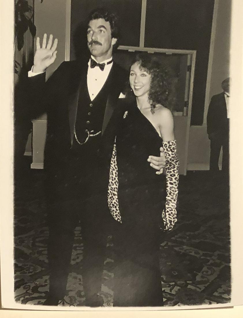 Tom Selleck and date Jilly Mack 1984 - photographers stamp verso: Taken Jan 28, 1984 by noted photographer Scott Downie w/ photographer stamp and description verso. 9x7 on Kodak paper. Reserve: $4.00 Shipping: Domestic: Flat-rate of $7.00 to anywhere within the cont