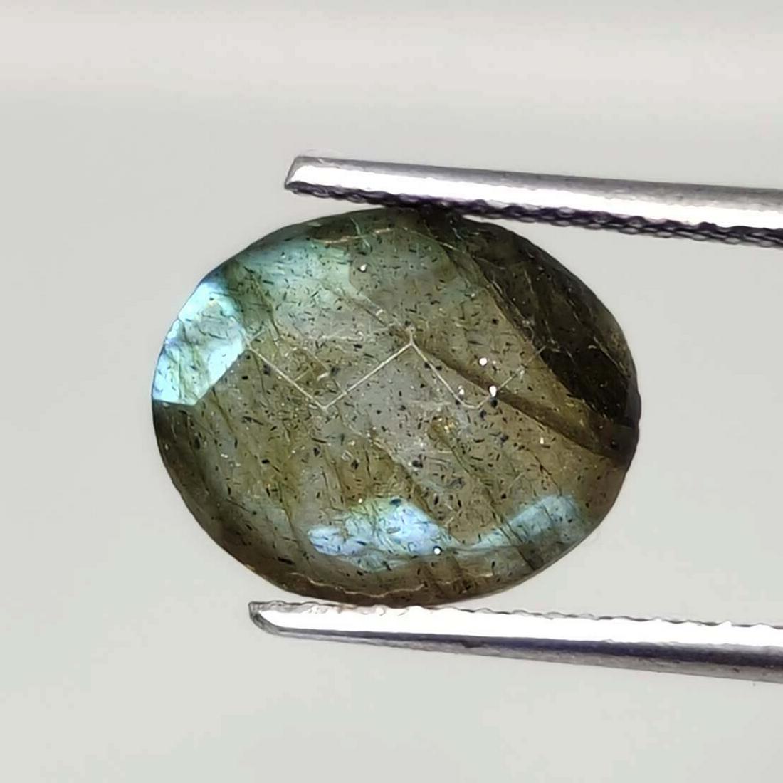 3.95 ct Natural Faceted Labradorite: No Reserve! Title: 3.95 ct Natural Faceted Labradorite Additional Information: Gemstones: Labradorite Carat Weights: 3.95 ct Size/Dimensions: 9 X 11 mm Origin : Labrador Materials & Techniques: Labrad