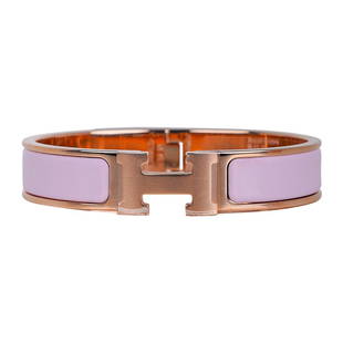 Hermes Rose Dragee Clic Clac H Narrow Enamel Bracelet Rose Gold PM: Hermes Clic H Bracelet featured in Rose Dragee Enamel. Rose Gold plated. Chic, modern and unmistakably Hermes! A hinged band allows the H to swivel and open the bracelet. Comes with pouch and