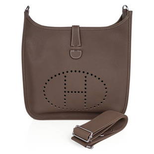 Hermes Bag Evelyne GM Etoupe Clemence Palladium Hardware New w/ Box: Guaranteed authentic Hermes Evelyne GM featured in neutral Etoupe. Rich with Palladium hardware and Clemence leather. Fabulous shoulder or cross body bag with roomy interior and rear outside deep