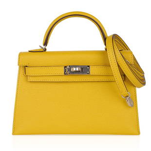 Hermes Kelly 20 Mini Sellier Bag Jaune de Naples Verso Chevre Palladium: Guaranteed authentic Hermes Kelly 20 Mini Sellier Verso bag featured in fabulous Jaune de Naples. This Hermes Kelly 20 is accentuated with Gold interior. Beautifully saturated Chevre leather with