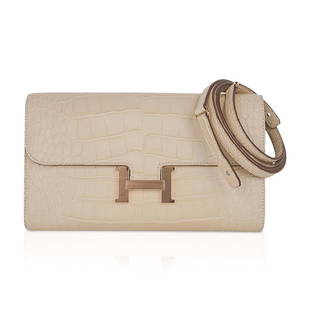 Hermes Constance Long To Go Wallet Vanille Matte Alligator Gold Hardware: Guaranteed authentic coveted Hermes Constance Long To Go Wallet featured in Vanille Matte Alligator. This stunning neutral Constance To Go is accentuated with Gold hardware. Detachable crossbody /