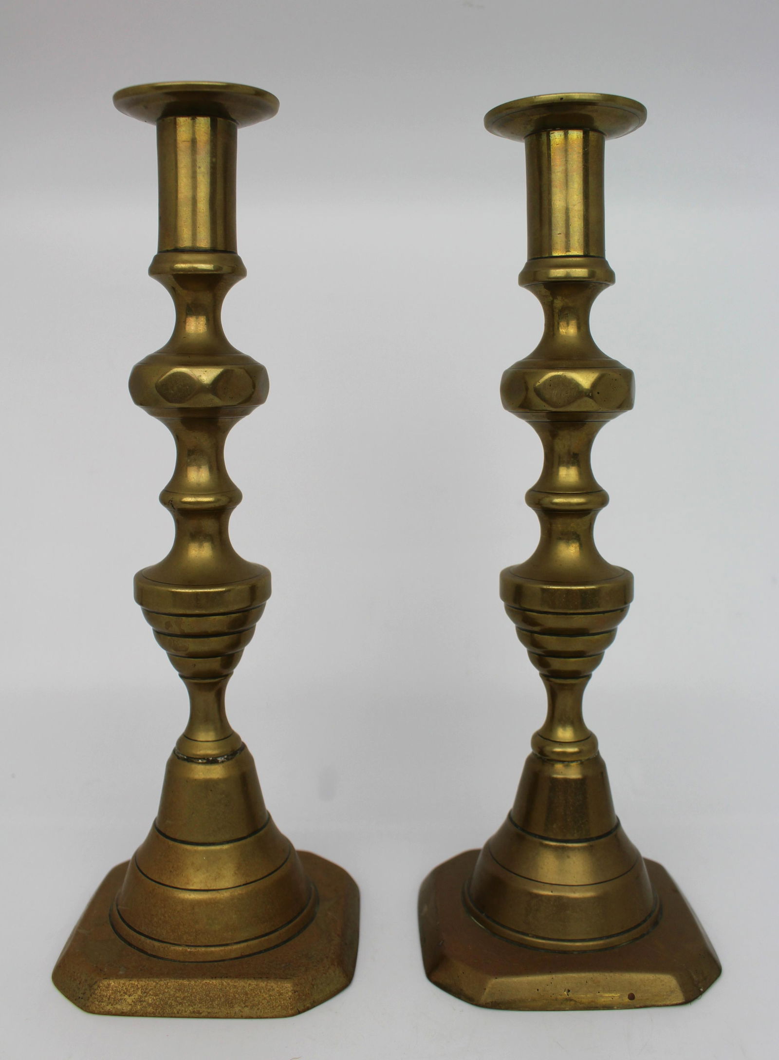 Pair of Antique Brass Candlesticks: Title: Pair of Antique Brass Candlesticks Description: Pair of Antique Brass Candlesticks. English, antique. Push up wicks. Good quality and weight. Measures 9 x 9 x 24.5 (height) cm Reserve: $60.00 S