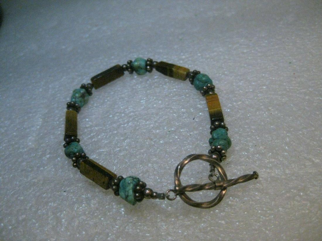 Sterling Southwestern Tiger's Eye & Turquoise Bracelet, Toggle Clasp, 7.5": Vintage Southwestern Tiger's Eye and Turquoise beaded bracelet with sterling silver toggle clasp - did not test fluted beads. This has natural tiger's eye square tube beads that are about 2/3" long -