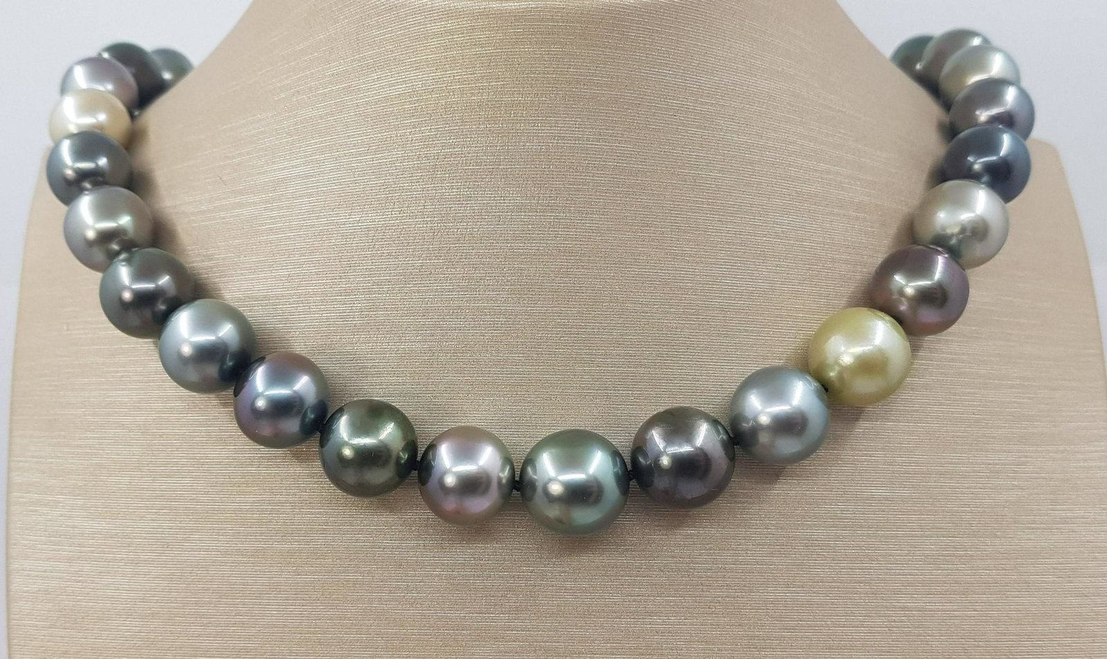Large 11x13.1mm Round Bright Multi Tahitian Pearls - Necklace: Title: Large 11x13.1mm Round Bright Multi Tahitian Pearls - Necklace Description: A stunning multi-coloured necklace of Tahitian pearls, selected for their shimmering peacock, pistachio, aubergine, ol