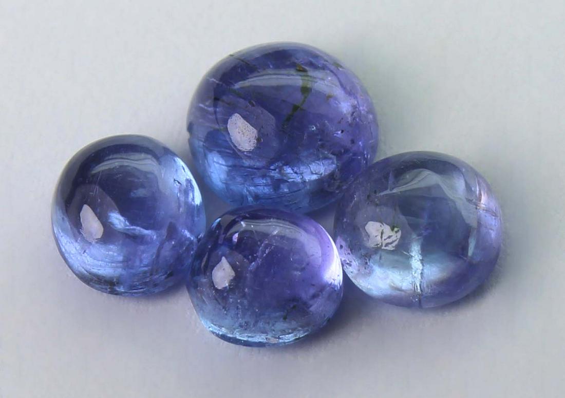 2.06 cts Natural Tanzanite Lot: No Reserve! Title: 2.06 cts Natural Tanzanite Lot Additional Information: Gemstone : Natural Tanzanite Shape and cut : Oval Cabochon Weight : 2.06 carats Measurements : 6.03-5.79x3.05 mm - 4.63-4.43x2