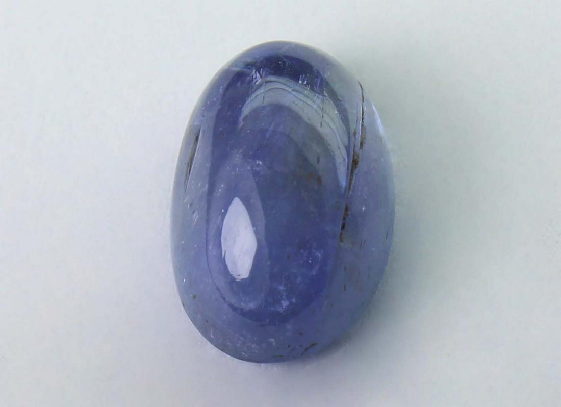 3.21 cts Natural Tanzanite: No Reserve! Title: 3.21 cts Natural Tanzanite Additional Information: Gemstone : Natural Tanzanite Shape and cut : Oval Cabochon Weight : 3.21 carats Measurements : 10.61x6.70x4.85 mm Color : Brown Tr