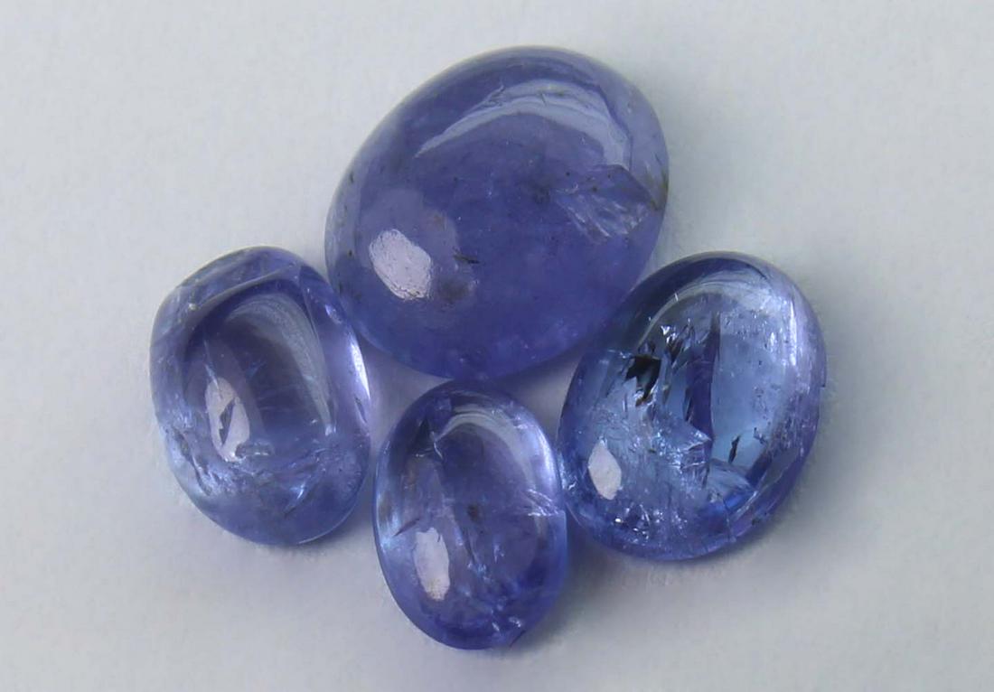 2.06 cts Natural Tanzanite Lot: No Reserve! Title: 2.06 cts Natural Tanzanite Lot Additional Information: Gemstone : Natural Tanzanite Shape and cut : Oval Cabochon Weight : 2.06 carats Measurements : 6.90x5.61x2.44 mm - 5.21x3.22x1