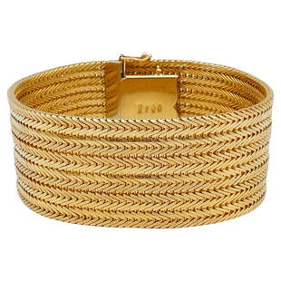 Vintage Cartier Braided Gold Bracelet: Description: A neat vintage Cartier bracelet made of 18k yellow gold with a braided glossy texture. Stamped with Cartier maker's mark, a hallmark for 18k gold, a country of origin (Italy) and a serial